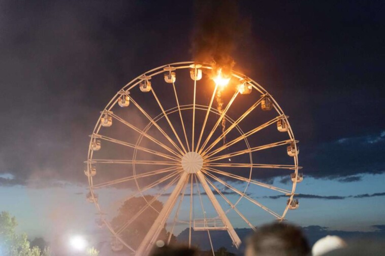 ferris-wheel-bursts-into-flames-at-german-music-festival,-injuring-30