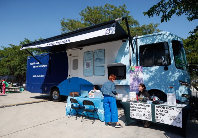 pro-life-advocates-counter-planned-parenthood-truck-offering-vasectomies,-abortions-outside-dnc-with-free-diapers