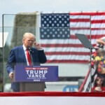 trump-ventures-outside-of-new-bulletproof-encasement-to-embrace-supporter-overcome-by-heat at-north-carolina-rally