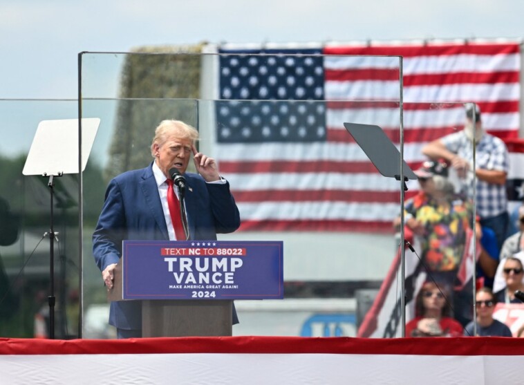 trump-ventures-outside-of-new-bulletproof-encasement-to-embrace-supporter-overcome-by-heat at-north-carolina-rally