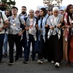 pro-palestinian-uncommitted-delegates-link-arms,-chant-‘ceasefire-now!’-ahead-of-kamala-harris-speech