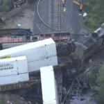 freight-trains-collide-in-us,-destroying-bridge-and-dumping-fuel