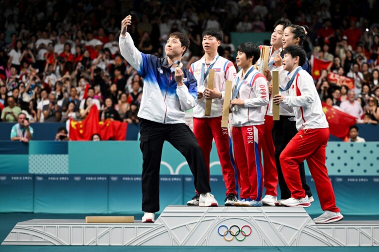 north-korea-table-tennis-champs-face-punishment-for-‘grinning’-in-olympics-selfie-with-rivals