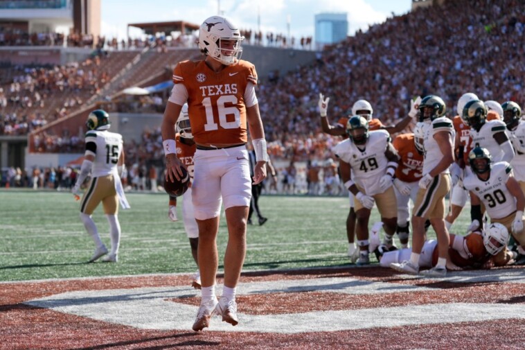 arch-manning-throws-first-college-touchdown,-runs-for-another-in-impressive-texas-showing