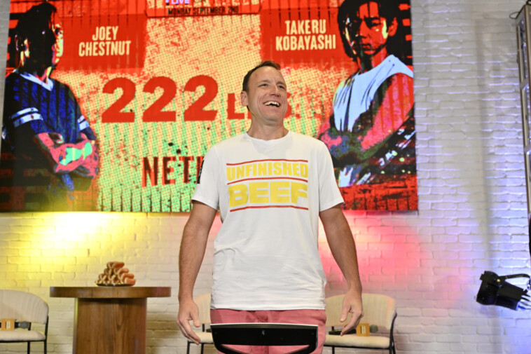 joey-chestnut-tops-takeru-kobayashi-with-new-world-record-of-83-hot-dogs-to-win-netflix-eating-battle