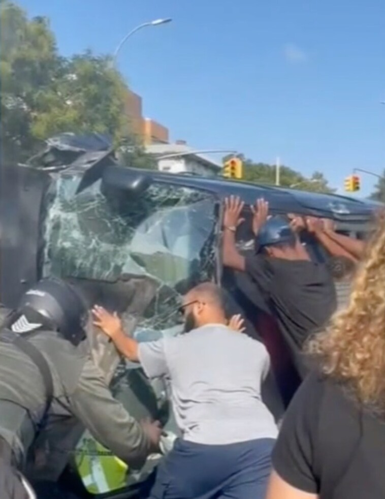 brooklyn-bystanders-show-incredible-strength-to-rescue-driver-from-overturned-minivan—-only-to-find-bottles-of-booze-next-to-him:-video