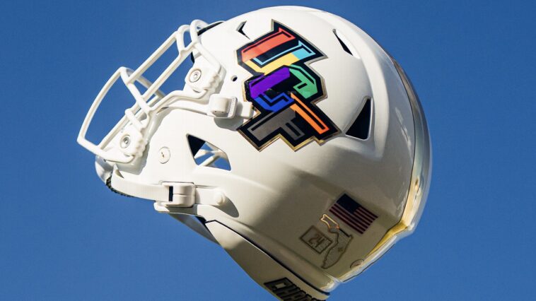 ucf-leads-week-2-uniforms-with-pediatric-cancer-awareness-month-helmet