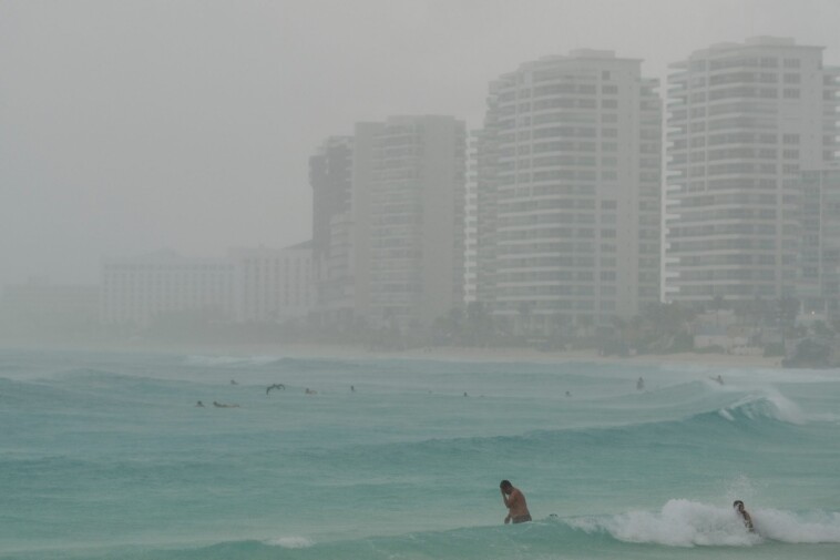 hurricane-helene-unleashes-fury-on-mexico-submerging-cancun-resorts-in-torrential-rain:-‘beach-gone’