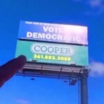 gun-coating-company-takes-action-when-‘vote-democratic’-billboard-appears-above-shop