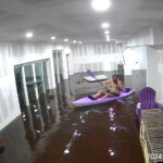 florida-man-paddles-around-tampa-home-as-helene-storm-surge-floods-living-room