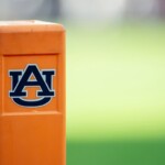 auburn-cheerleader-knocks-down-oklahoma-player-running-onto-field-while-performing-stunts