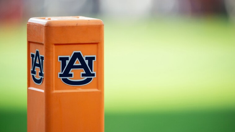 auburn-cheerleader-knocks-down-oklahoma-player-running-onto-field-while-performing-stunts