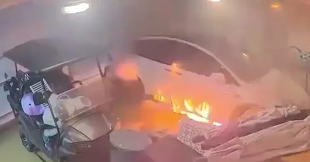 electric-time-bomb:-tesla-bursts-into-flames-inside-garage-flooded-by-hurricane-helene