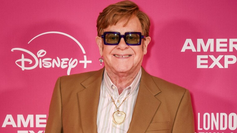 elton-john-wears-his-old-kneecap-as-a-pendant-around-his-neck-following-latest-health-scare