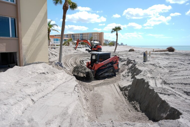 florida-digs-out-of-mountains-of-sand-swept-in-by-back-to-back-hurricanes