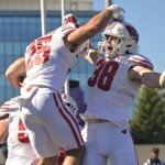 wisconsin-strength-and-conditioning-coach-dives-in-lake-michigan-after-northwestern-victory