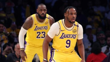 mic’d-up-lebron-james-gives-advice-to-son-bronny-on-bench-before-historic-nba-debut