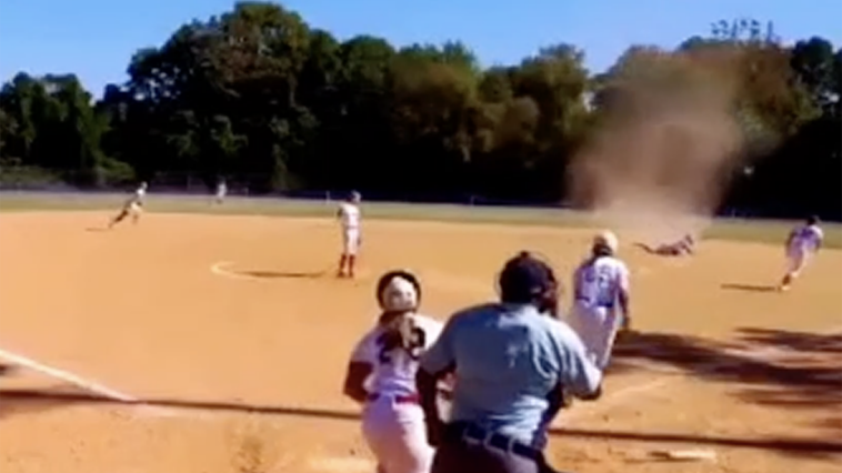 virginia-softball-player-contends-with-dust-devil-as-she-makes-diving-play-for-out