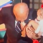 second-victim:-biden-puts-baby’s-entire-foot-in-his-mouth-after-biting-another-baby-at-halloween-celebration-(video)