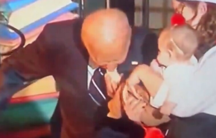 second-victim:-biden-puts-baby’s-entire-foot-in-his-mouth-after-biting-another-baby-at-halloween-celebration-(video)