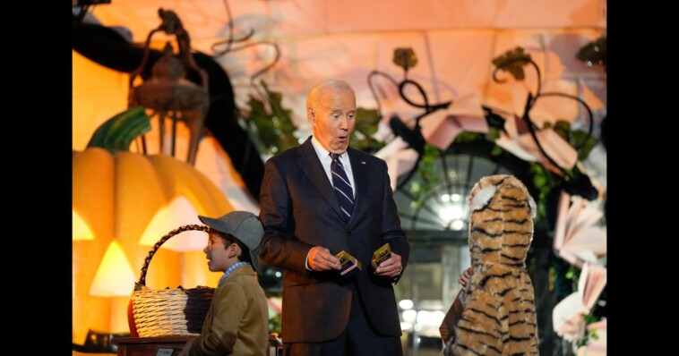 ‘who-is-letting-this-happen?’:-biden-caught-biting-babies-in-absurd-scene-at-wh-halloween-celebration