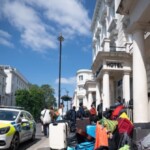 migrants-to-be-housed-in-uk-hotels-for-another-three-years-as-gov’t-struggles-to-clear-backlog:-report