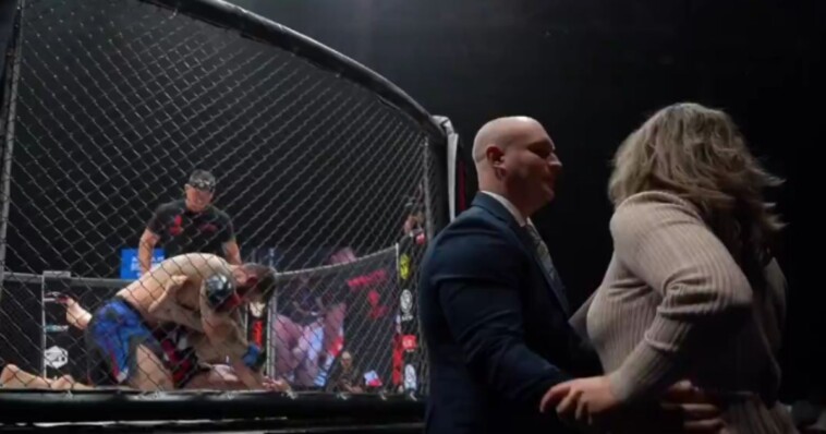 mma-fighter’s-wife-rushes-ring-begging-for-bout-to-be-stopped,-doesn’t-realize-her-husband-is-locking-in-the-finishing-move