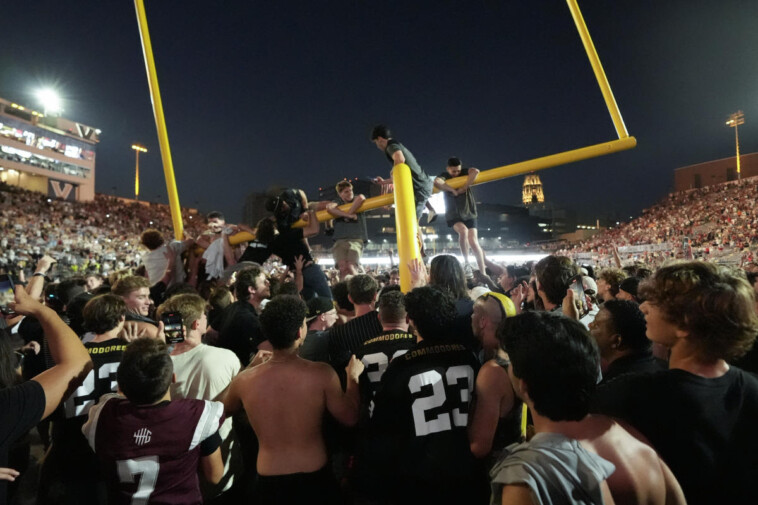 vanderbilt-fans-tear-down-goal-posts-after-alabama-upset,-social-media-follows-trek-to-nashville