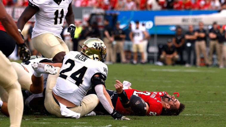 nc-state-quarterback-grayson-mccall-carted-off-the-field-after-scary-hit-sends-helmet-flying