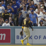 dodgers-fans-throw-stuff-at-padres,-jurickson-profar,-who-earlier-in-game-taunted-them-after-robbing-mookie-betts-of-a-hr