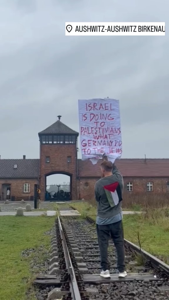 polish-artist-sparks-outrage-outside-auschwitz-with-sign-saying-‘israel-is-doing-to-the-palestinians-what-the-germans-did-to-the-jews’