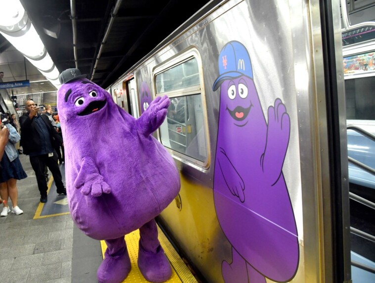 grimace-rides-the-rails-on-nyc’s-purple-line-with-mets-fans-ahead-of-nlds-game-3-against-phillies