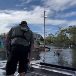 florida-deputies-rescue-boy-floating-on-piece-of-fence-in-floodwaters