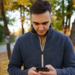 sad:-man-almost-lets-beautiful-autumn-day-distract-him-from-doomscrolling-on-phone