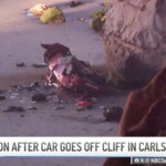 driver-miraculously-survives-after-flying-off-cliff,-landing-on-beach-after-police-pursuit