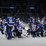 blues-lw-dylan-holloway-exits-in-stretcher,-rushed-to-hospital-after-taking-puck-to-throat