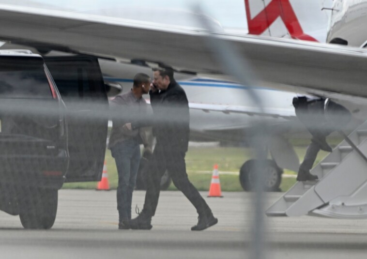 elon-musk-snapped-in-spacex-shoes-as-he-heads-to-mar-a-lago 