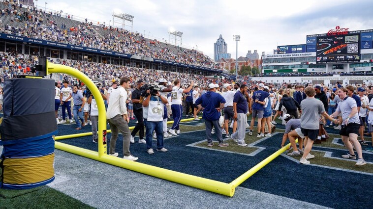 fans-topple-goal-posts-after-georgia-tech-upsets-fourth-ranked-miami-in-acc-thriller