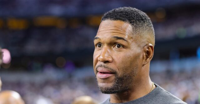 fans-demand-michael-strahan-be-fired-for-way-he-stood-during-veterans-day-weekend-national-anthem