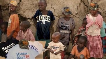 insult-to-injury:-african-kids-receive-overstock-harris-walz-hats-to-wear-with-their-yankees-world-championship-shirts