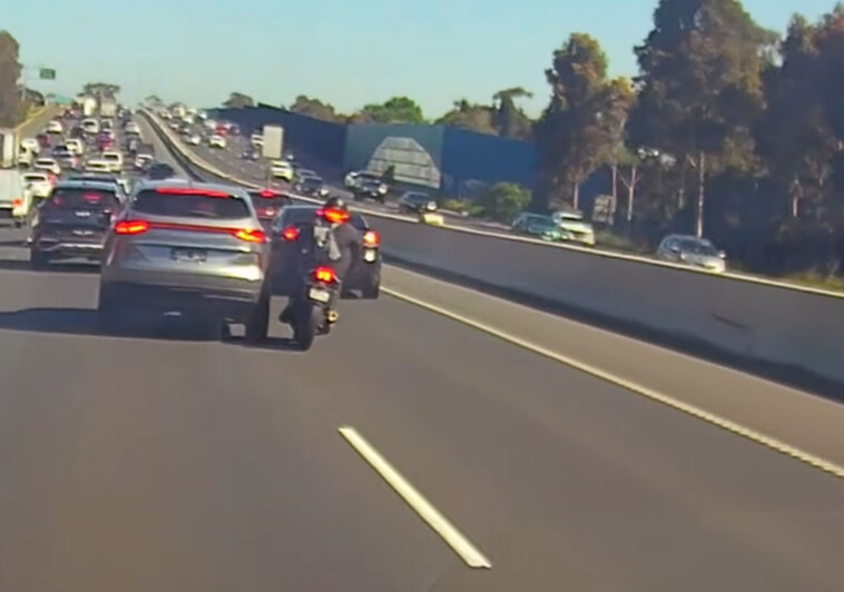 motorcyclist-collides-with-car,-lands-on-top-of-vehicle-in-insane-video