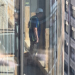 creepy-nyc-construction-workers-film,-use-binoculars-to-spy-on-female-students-in-college-dorm