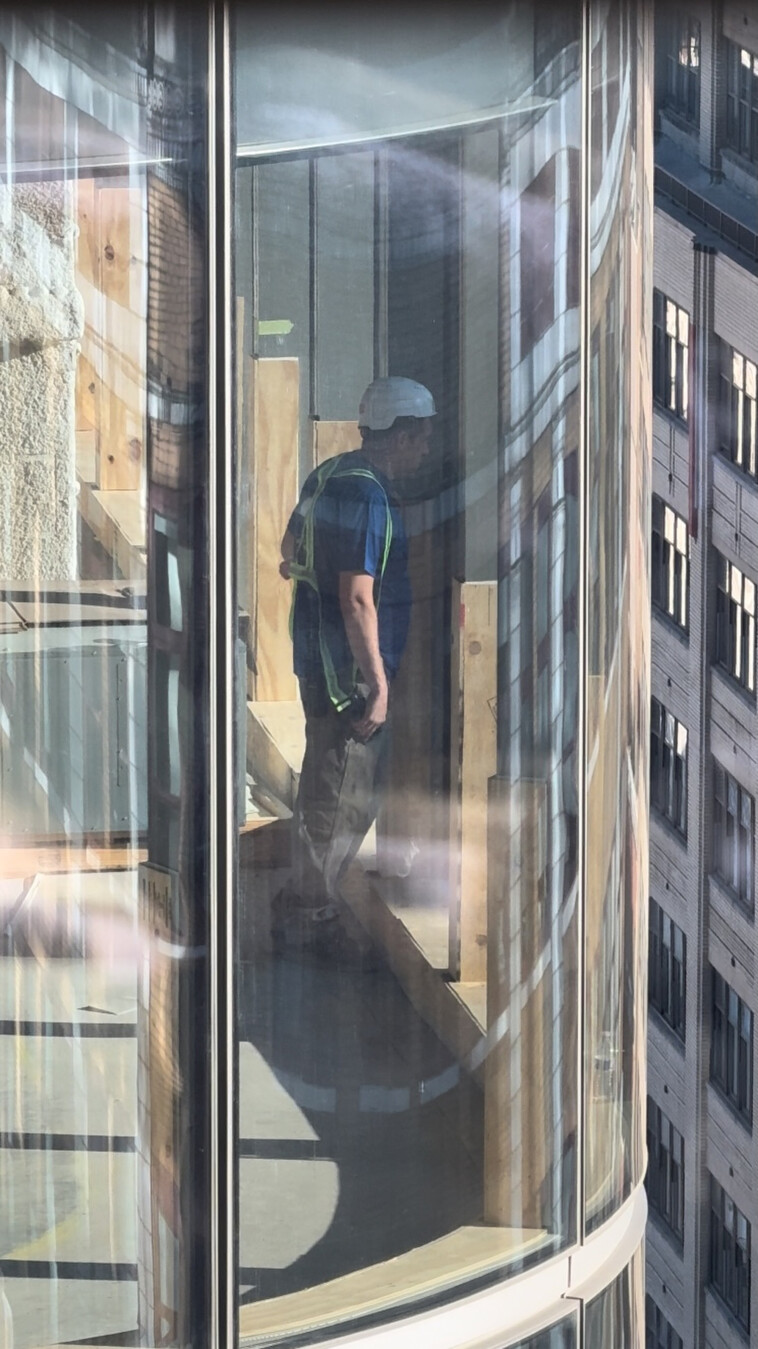 creepy-nyc-construction-workers-film,-use-binoculars-to-spy-on-female-students-in-college-dorm