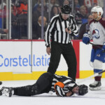 nhl-referee-mitch-dunning-stretchered-off-after-scary-collision-during-flyers-avalanche-game