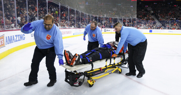 nhl-referee-stretchered-off-ice-and-taken-to-hospital-after-collision