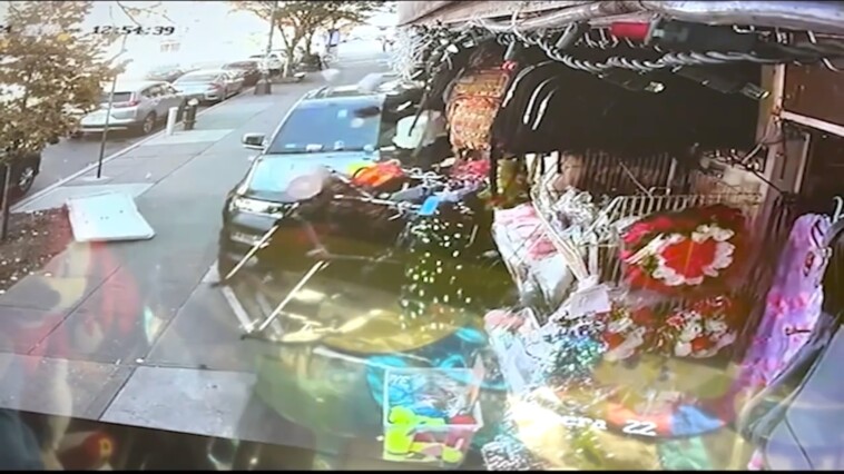 surveillance-video-shows-car-fly-down-brooklyn-sidewalk-narrowly-missing-pedestrians