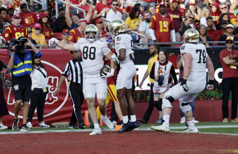 no.-5-notre-dame-clinches-college-football-playoff-spot-with-2-pick-6s-in-49–35-win-over-usc