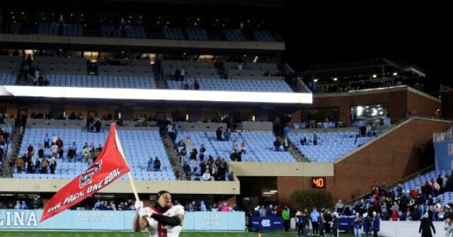 watch:-massive-brawl-breaks-out-in-north-carolina-north-carolina-state-game-after-wolfpack-attempt-to-plant-flag