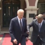 president-of-angola-jerks-biden’s-arm-to-guide-him-during-arrival-ceremony-(video)