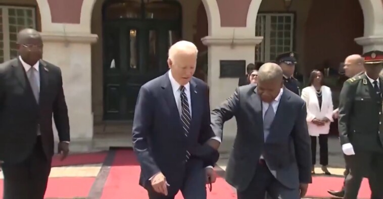 president-of-angola-jerks-biden’s-arm-to-guide-him-during-arrival-ceremony-(video)